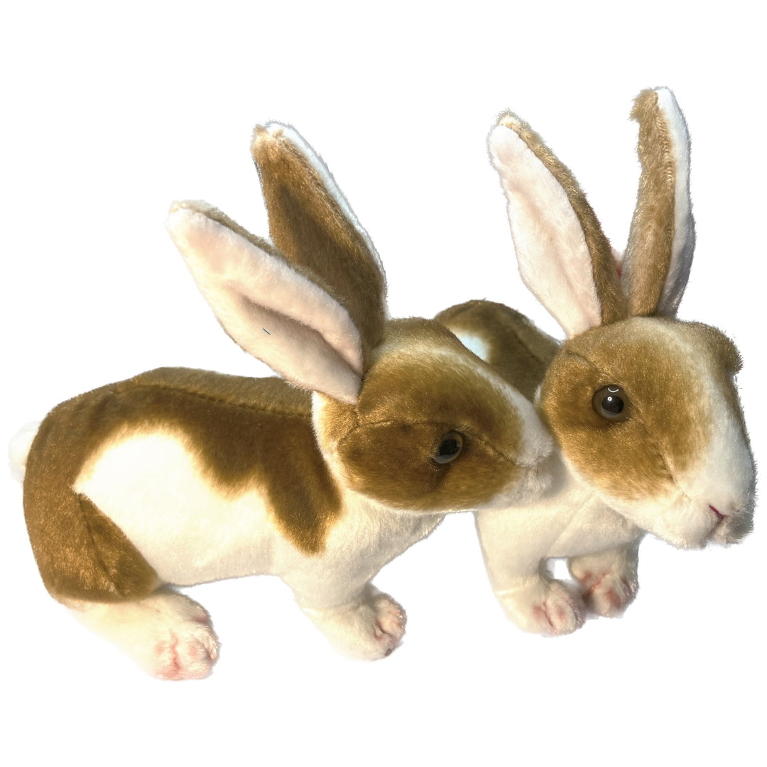 Two cute toy rabbits playing together.